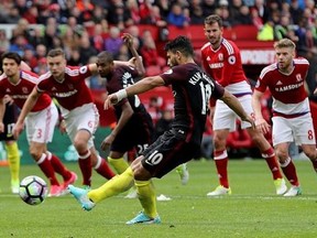 Manchester City&#039;s Sergio Aguero scores his side&#039;s first goal of the game against Middlesbrough, from the penalty spot during their English Premier League soccer match at the Riverside Stadium in Middlesbrough, England, Sunday April 30, 2017. (Owen Humphreys/PA via AP)