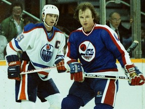 Edmonton Oilers star Wayne Gretzky, left, and Winnipeg Jets defenceman Randy Carlyle during Game 2 of their Smythe Division semifinal playoff series on April 5, 1984, at Northlands Coliseum.