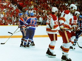 Edmonton Oilers'Wayne Gretzky, Mark Messier and jari Kurri celebrate scoring on the Calgary Flames during playoff action at Calgary's Saddledome in April 1988.