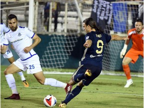 FC Edmonton defender Adam Straith, left, attempts to block a shot from North Carolina FC striker Matthew Fondy in North American Soccer League play on Saturday, April 15 at WakeMed Soccer Park in Cary, North Carolina. North Carolina FC won 3-1.