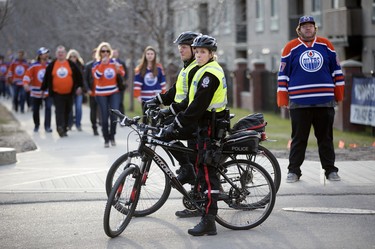 Edmonton Police watch as Oilers fans arrive at Rogers Place prior to the Edmonton Oilers and San Jose Sharks NHL playoff, in Edmonton Thursday April 20, 2017. Photo by David Bloom For a Jonny Wakefield story running April 18, 2017.