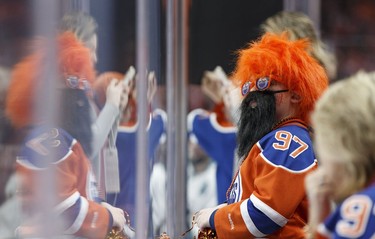 Fans, fans in the stands: A young Edmonton fan cheers the start of a Stanley Cup playoffs game between the Edmonton Oilers and the San Jose Sharks at Rogers Place in Edmonton on April 12, 2017.