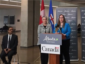 Alberta Labour Minister Christina Gray (right) and federal Labour Minister Patricia Hajdu answer questions at a news conference on April 19 announcing the new employer liaison service as federal Infrastructure Minister Amarjeet Sohi looks on.