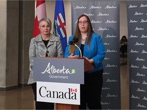 Alberta Labour Minister Christina Gray (right) and federal Labour Minister Patricia Hajdu answer questions at a news conference on April 19 announcing the new employer liaison service.