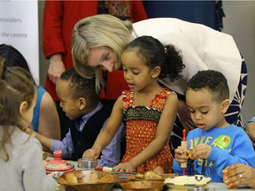 Premier Rachel Notley talks with Besma Behik, 4, at the Intercultural Child and Family Centre in Edmonton on Thursday, April 6, 2017.