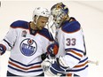 Edmonton Oilers defenseman Andrej Sekera (2) celebrates with Edmonton Oilers goalie Cam Talbot (33) after a 3-1 victory against the San Jose Sharks in Game 6 of a first-round NHL hockey playoff series Saturday, April 22, 2017, in San Jose, Calif. Edmonton Oilers wins the series 4-2.