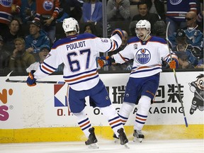 Edmonton Oilers left wing Anton Slepyshev (42) celebrates after scoring a goal with teammate Benoit Pouliot (67) during the second period against the San Jose Sharks in Game 6 of a first-round NHL hockey playoff series Saturday, April 22, 2017, in San Jose, Calif.