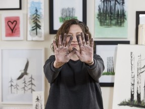 Artist June Heskett makes paintings and thank-you cards for Fort McMurray residents using charcoal scavenged from forests hit by the 2016 Fort McMurray wildfires as seen in Fort McMurray on Saturday, April 8, 2017.