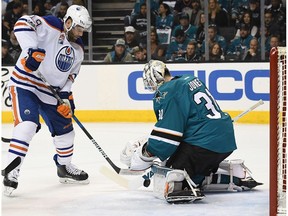 Goalie Martin Jones #31 of the San Jose Sharks blocks the shot of Patrick Maroon #19 of the Edmonton Oilers during the first period in Game Four of the Western Conference First Round during the 2017 NHL Stanley Cup Playoffs at SAP Center on April 18, 2017 in San Jose, California.