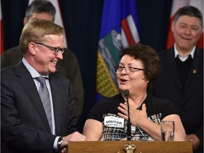 Beth Ann Auger (right), chairperson of the Mistassiniy school council, with Education Minister David Eggen.