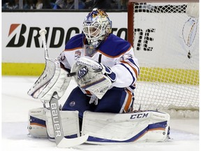Edmonton Oilers goalie Cam Talbot stops a shot against the San Jose Sharks during the first period in Game 3 of a first-round NHL hockey playoff series Sunday, April 16, 2017, in San Jose, Calif.