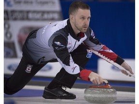 Canada skip Brad Gushue makes a shot against Sweden during the fifth draw of the Men's World Curling Championships in Edmonton on Sunday, April 2, 2017. (Jonathan Hayward/The Canadian Press)