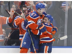 Edmonton Oilers' Connor McDavid (97) and Leon Draisaitl (29) celebrate a goal during overtime NHL action against the Anaheim Ducks, in Edmonton, Alta., on Saturday, April 1, 2017.