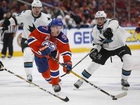 San Jose Sharks forward Melker Karlsson, right, looks on as Edmonton Oilers captain Connor McDavid gets away from him during overtime action on April 20, 2017.