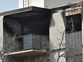 Damage is visible after an apartment fire on an upper-level corner suite of the Southgate Apartments, 10405 Saskatchewan Dr. in Edmonton on April 29, 2017. Two residents and a firefighter were taken to hospital with minor injures.