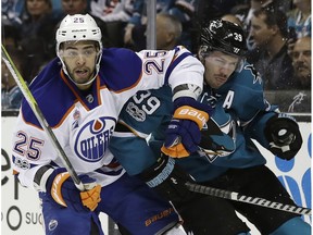 San Jose Sharks' Logan Couture (39) gets tangled with Edmonton Oilers' Darnell Nurse (25) during the first period in Game 4 of a first-round NHL hockey playoff series Tuesday, April 18, 2017, in San Jose, Calif.