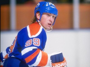 Wayne Gretzky of the Edmonton Oilers looks on during a game against the Los Angeles Kings in December 1987 at the Great Western Forum in Inglewood, Calif.