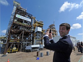 Mayor Don Iveson takes a cellphone picture of the new Enerkem waste-to-biofuels facility during the opening ceremonies in 2014.