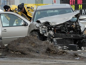 Police investigate a fatal collision between an 84 year old woman driving a VW Jetta and an EPS constable driving an unmarked Altima at 75st-76av in Edmonton Ab. on Thursday, Mar. 8, 2012. The woman was killed in the crash.