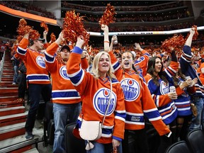 Edmonton Oilers' fans cheer the team's goal during the first period of playoff hockey action against the San Jose Sharks in Edmonton, Thursday, April 20, 2017.