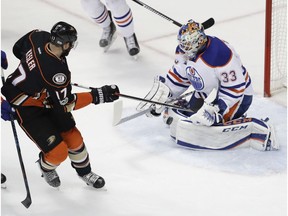 Edmonton Oilers goalie Cam Talbot, right, blocks a shot by Anaheim Ducks center Ryan Kesler during the first period in Game 2 of a second-round NHL hockey Stanley Cup playoff series in Anaheim, Calif., Friday, April 28, 2017.