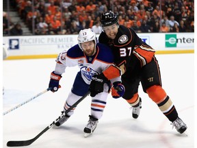 Nick Ritchie of the Anaheim Ducks battles for a loose puck against David Desharnais of the Edmonton Oilers in Game 1 of the Western Conference second playoff round at Honda Center on Wednesday, April 26, 2017, in Anaheim, California. (Sean M. Haffey/Getty Images)