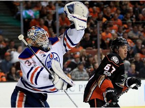 Cam Talbot #33 of the Edmonton Oilers catches a shot on goal as Rickard Rakell #67 of the Anaheim Ducks looks on during the third period of Game Two of the Western Conference Second Round during the 2017  NHL Stanley Cup Playoffs at Honda Center on April 28, 2017 in Anaheim, California.