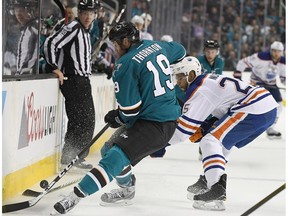 Joe Thornton #19 of the San Jose Sharks battles for control of the puck with Darnell Nurse #25 of the Edmonton Oilers during the second period in Game Three of the Western Conference First Round during the 2017 NHL Stanley Cup Playoffs at SAP Center on April 16, 2017 in San Jose, California. The Oilers won the game 1-0.