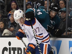 Connor McDavid #97 of the Edmonton Oilers battles for the puck with Marc-Edouard Vlasic #44 of the San Jose Sharks during the third period in Game Three of the Western Conference First Round during the 2017 NHL Stanley Cup Playoffs at SAP Center on April 16, 2017 in San Jose, California. The Oilers won the game 1-0.