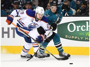 Leon Draisaitl #29 of the Edmonton Oilers battles for control of the puck with Justin Braun #61 of the San Jose Sharks during the first period in Game Three of the Western Conference First Round during the 2017 NHL Stanley Cup Playoffs at SAP Center on April 16, 2017 in San Jose, California.