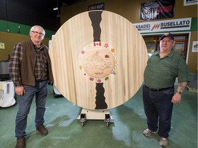 Menno Klaassen (left) and Bill Nestor, along with other members of Edmonton's Woodturners Guild, have created a large commemorative platter in honour of Canada's 150th birthday.