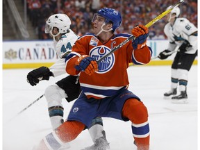 Edmonton's Connor McDavid (97) battles San Jose's Marc-Edouard Vlasic (44) during the third period of a Stanley Cup playoffs game between the Edmonton Oilers and the San Jose Sharks at Rogers Place in Edmonton on Wednesday, April 12, 2017.