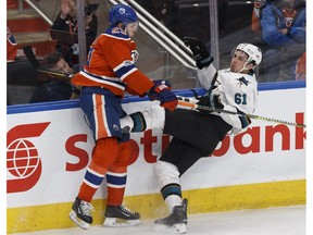 Edmonton's Leon Draisaitl (29) hits San Jose's Justin Braun (61) during the first period of a Stanley Cup playoffs game between the Edmonton Oilers and the San Jose Sharks at Rogers Place in Edmonton on Friday, April 14, 2017.