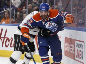Edmonton's Patrick Maroon (19) battles LA's Drew Doughty (8) during the second period of a NHL game between the Edmonton Oilers and the LA Kings at Rogers Place in Edmonton on Tuesday, March 28, 2017.