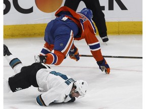 Edmonton Oilers forward Zack Kassian mows down San Jose Sharks defenceman Brenden Dillon in Game 2 of their opening-round playoff series at Rogers Place in Edmonton on Friday, April 14, 2017. (Ian Kucerak)