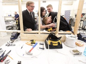 Education Minister David Eggen gets a demonstration from trades  students at Westmount Junior High on Thursday, April 13, 2017..
