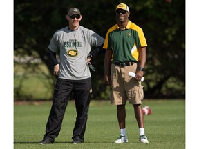 Eskimos' Head Coach Jason Maas, left, and General Manager Ed Hervey socialize during the mini-camp at Historic Dodgertown in Vero Beach on Sunday, April 17, 2016.