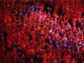 Fans cheer the Edmonton Oilers at the start of the game between the San Jose Sharks during game one of the first round of NHL playoff action at Rogers Place in Edmonton, Wednesday, April 12, 2017.