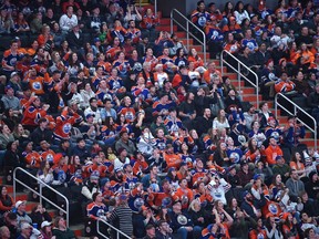 Fans react to a missed goal opportunity by the Oilers who are in San Jose taking on the Sharks, during Game 4 on the scoreboard screen at Rogers Place during the Oilers Orange Crush Road Game Watch Party in Edmonton, April 18, 2017.