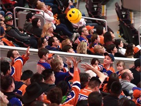 Fans toss a beach ball as they watch the Oilers in San Jose taking on the Sharks during game 6 on the score board screen at Rogers Place during the Oilers Orange Crush Road Game Watch Party in Edmonton, April 22, 2017.