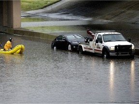 Fire rescue had to perform a water rescue on Whitemud Drive under 111 Street as heavy rains in the Edmonton area caused flooding in the region last year.