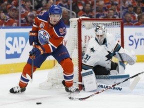 Edmonton's Ryan Nugent-Hopkins spins in front of San Jose goaltender Martin Jones (31) during a Stanley Cup playoffs game between the Edmonton Oilers and the San Jose Sharks at Rogers Place in Edmonton on April 12, 2017.