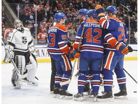 The Edmonton Oilers celebrate a goal in front of Los Angeles Kings goalie Jonathan Quick in Edmonton on March 28, 2017. (The Canadian Press)