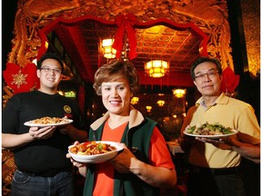 Family members Miles, Amy and Kinman Quon hold up plates of food from. The Lingnan at 10582 104 St.