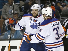 Edmonton Oilers center Leon Draisaitl (29) celebrates with teammate Drake Caggiula (36) after scoring a goal against the San Jose Sharks during the second period in Game 6 of a first-round NHL hockey playoff series Saturday, April 22, 2017, in San Jose, Calif.