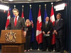 Liberal interim leader David Swann speaks at a news conference demanding an extension of the government's labour legislation review. He is joined by (from left) Amber Ruddy, of the Canadian Federation of Independent Business, Progressive Conservative MLA Richard Gotfried and Wildrose MLA Glenn van Dijken.