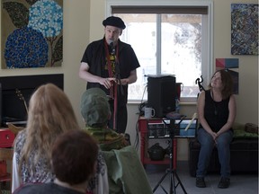 Luke Tracey Newmann reads at the Edmonton Poets House while Jade O'Riley listens on Sunday April 16, 2017 as part of the Edmonton Poetry Festival.