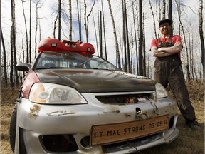 Marv Shine's Honda Civic was transformed by he and his son with symbols to remember the 2016 Fort McMurray wildfire. It has items to offer assistance to motorists if needed.
