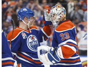 Edmonton Oilers' Matt Hendricks (23) congratulates goaltender Cam Talbot (33) after defeating the Los Angeles Kings during NHL action in Edmonton, Alta., on Monday, March 20, 2017.