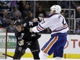 San Jose Sharks' Micheal Haley (38) fights with Edmonton Oilers' Milan Lucic during the first period of an NHL hockey game Thursday, April 6, 2017, in San Jose, Calif.